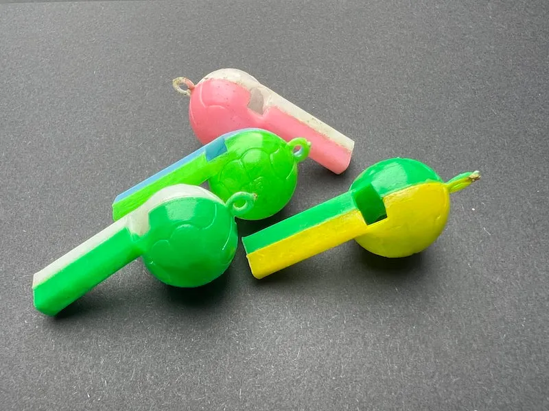 Loud Football Shaped Plastic Whistles - Made in Hong Kong